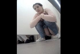 Cute Girl pees in the toilet